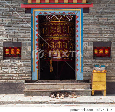 Bouddist Chapel with huge Prayer Wheel inside. Bouddist Chapel with huge Prayer Wheel inside. 61769127