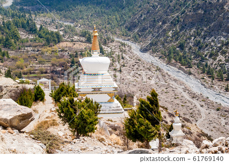 Picture of Buddhist stupa in Himalayan mountains. 61769140
