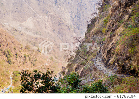 Picture of trekking foothpath in mountains 61769194