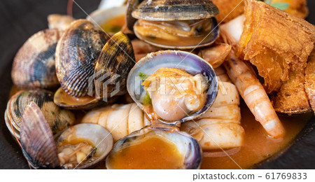 Fish soup, typical seafood dish of Italian cuisine. 61769833