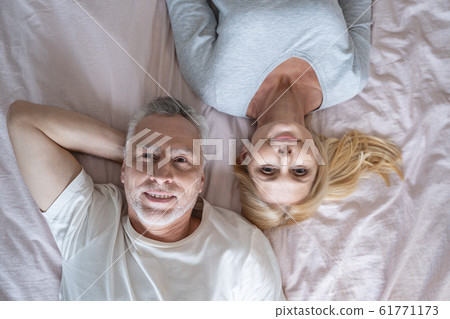 Man and woman on the bed together stock photo Man and woman on the bed together stock photo 61771173