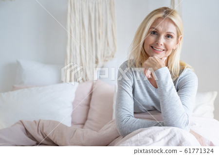 Confident smiling woman in the morning stock photo Confident smiling woman in the morning stock photo 61771324