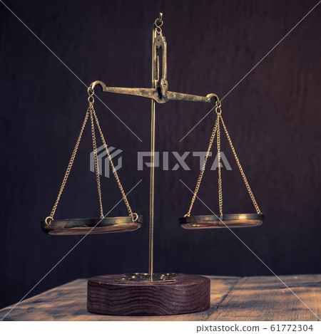 Law scales on table. Symbol of justice Law scales on table. Symbol of justice 61772304