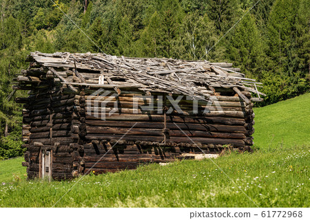 Old wooden barn with broken roof - Val di Fiemme Trentino Italy Old wooden barn with broken roof - Val di Fiemme Trentino Italy 61772968