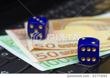 Two dices and euro banknotes on keypad Two dices and euro banknotes on keypad 61773085