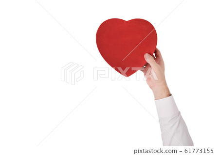 Vintage style red heart shaped box in male hand Vintage style red heart shaped box in male hand 61773155