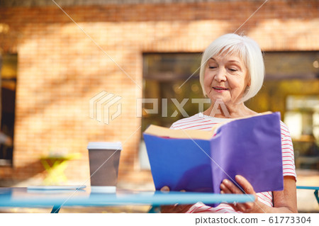 Calm aged woman enjoying her day off Calm aged woman enjoying her day off 61773304