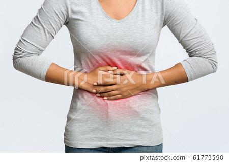 Close up of african woman having menstrual abdominal pain Close up of african woman having menstrual abdominal pain 61773590