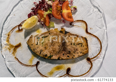 King mackerel steak with salad and tomato King mackerel steak with salad and tomato 61774133