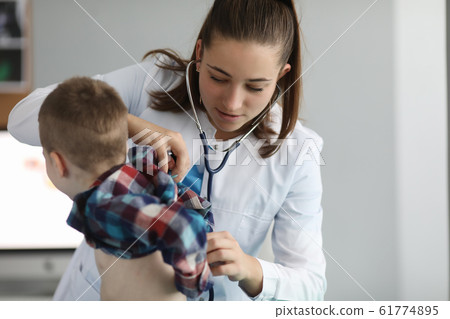 Pretty doctor in clinic office Pretty doctor in clinic office 61774895
