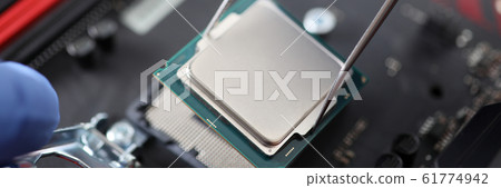 Man working with computer equipment 61774942