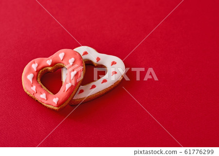 Two decorated with icing and glazed heart shape 61776299