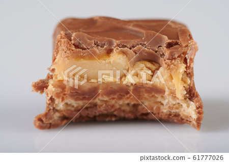 Bite of candy bar Bite of candy bar 61777026
