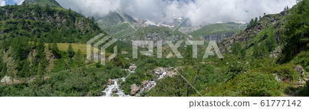 Trekking in Italian Alps mountain 61777142