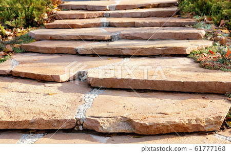 A paved path made of coarse sandstone A paved path made of coarse sandstone 61777168