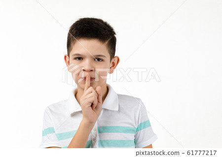 cute little boy in t-shirt asking to be quiet cute little boy in t-shirt asking to be quiet 61777217