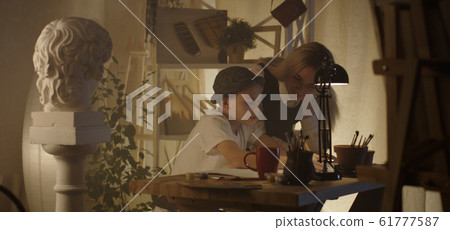 Teacher and student in art class 61777587