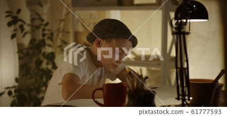 Boy drawing and stretching Boy drawing and stretching 61777593