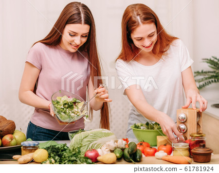 family unity cooking leisure sisters salad kitchen 61781924