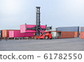Container handlers in the harbor, transportation 61782550