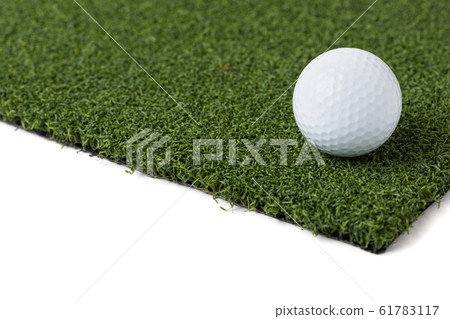 Golf Ball Resting on Section of Artificial Turf Golf Ball Resting on Section of Artificial Turf 61783117