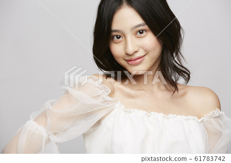 Beauty portrait of woman in dress 61783742