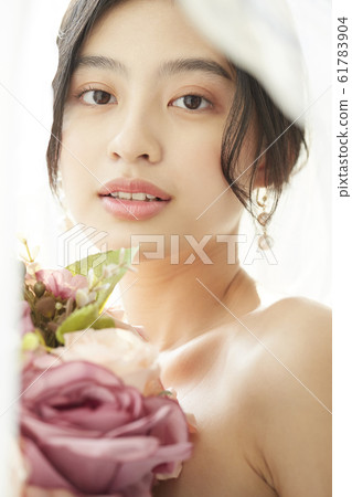 Portrait of woman in prom dress 61783904