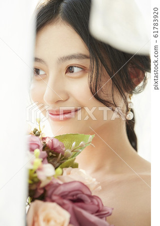 Portrait of woman in prom dress 61783920