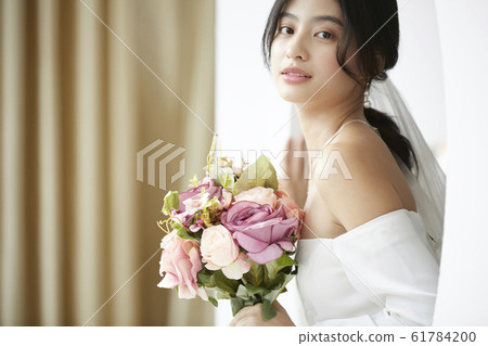 Portrait of woman in prom dress 61784200
