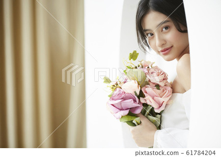 Portrait of woman in prom dress Portrait of woman in prom dress 61784204