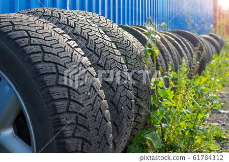 sets of car tires with disks are on the street sets of car tires with disks are on the street 61784312