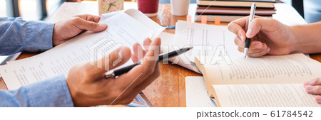 tutor and college students teaching school work 61784542