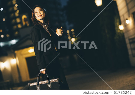 Business woman on the way home from work 61785242