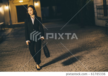 Business woman on the way home from work 61785336