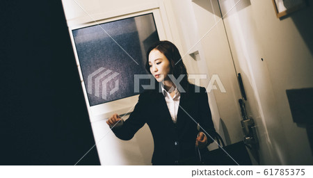 Business woman on the way home from work 61785375