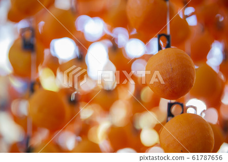 Dried persimmon in production 61787656
