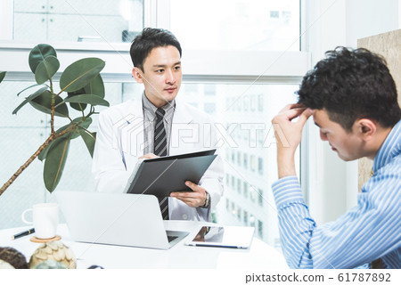 A man consulted by a doctor 61787892
