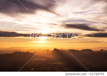Beautiful Asian limestone mountain landscape dramatic sunrise at Pha Nok An cliff. Phu Kradueng, Loei - Thailand 61789795