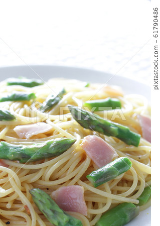 Spring pasta with green vegetable buds and green asparagus Spring pasta with green vegetable buds and green asparagus 61790486