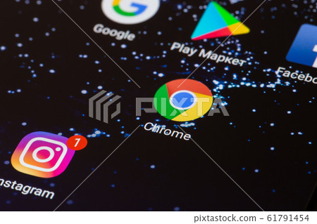 the Google Chrome logo on the smartphone screen close-up. 61791454