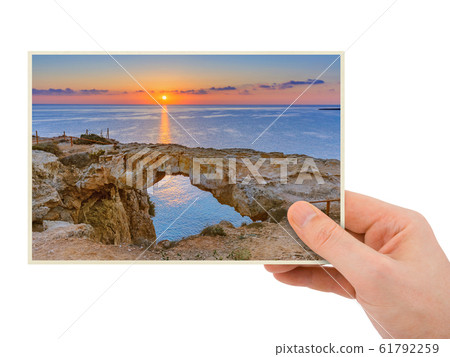 Hand and Famous stone Sin Bridge at sunrise in 61792259