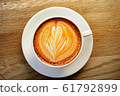 cup of the latte art coffee with warm light 61792899
