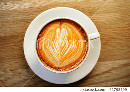 cup of the latte art coffee with warm light cup of the latte art coffee with warm light 61792899