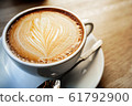 cup of the latte art coffee with warm light 61792900