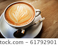 cup of the latte art coffee with warm light 61792901