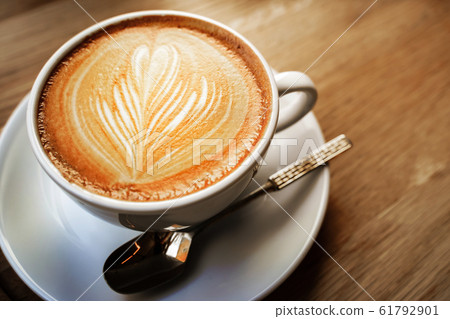 cup of the latte art coffee with warm light cup of the latte art coffee with warm light 61792901