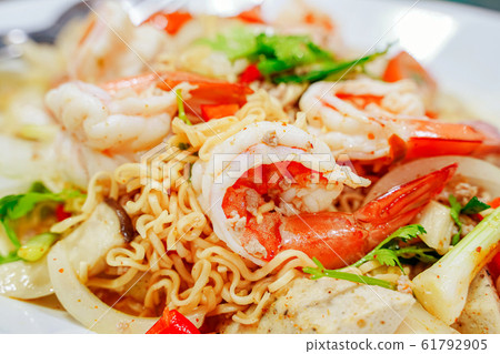 Spicy seafood salad with instant noodle. Thai food Spicy seafood salad with instant noodle. Thai food 61792905