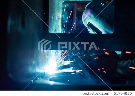 Welder working in factory 61794930