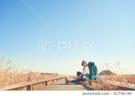 Korean young woman backpacking. 61796190