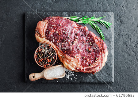 Marbling ribeye steak on slate board Marbling ribeye steak on slate board 61796682